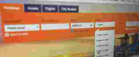 A blurred screenshot of the top part of a travel booking website